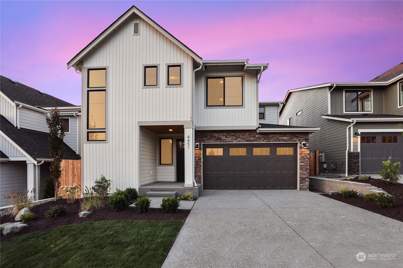 4418 242nd Place Southeast, Unit SL 25 Bothell, WA 98021 - Photo 1 of 36 a front view of a house with garden