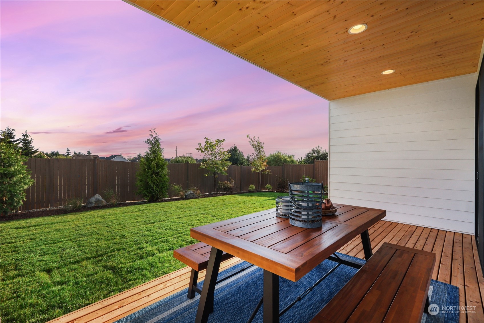 4418 242nd Place Southeast, Unit SL 25 Bothell, WA 98021 - Photo 11 of 36 a view of a chairs and table on the wooden deck