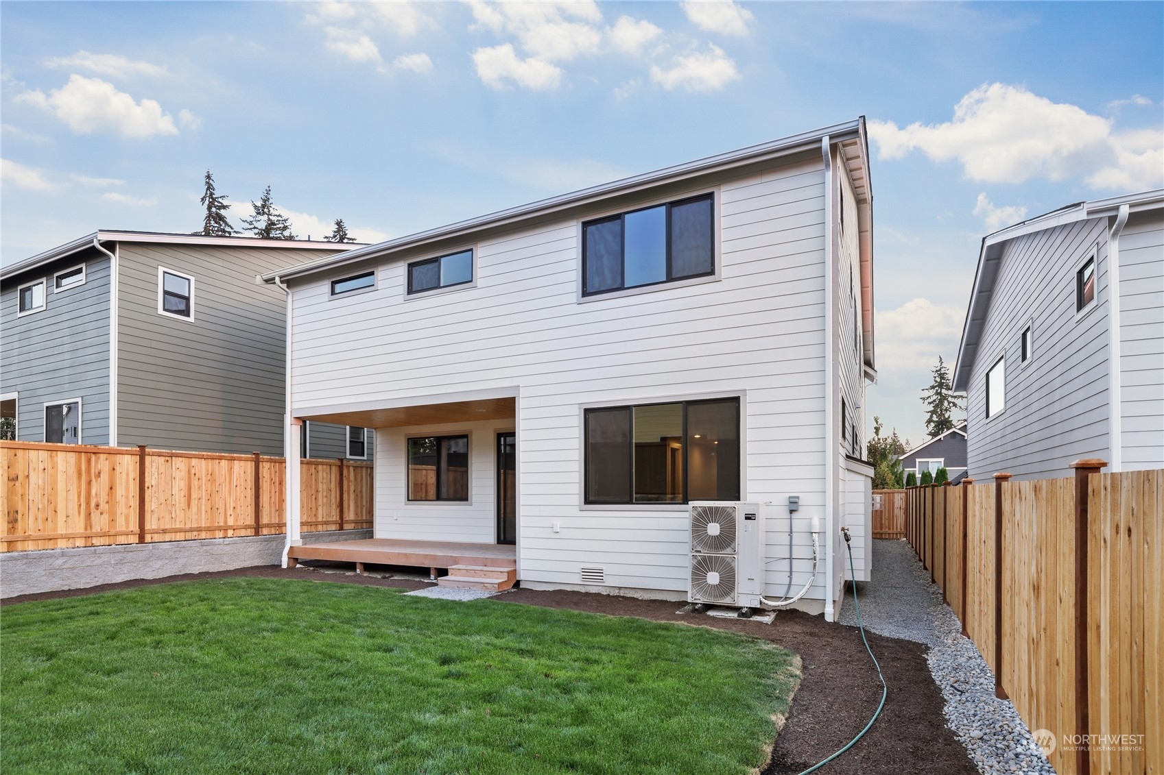 4418 242nd Place Southeast, Unit SL 25 Bothell, WA 98021 - Photo 31 of 36 a front view of a house with a yard