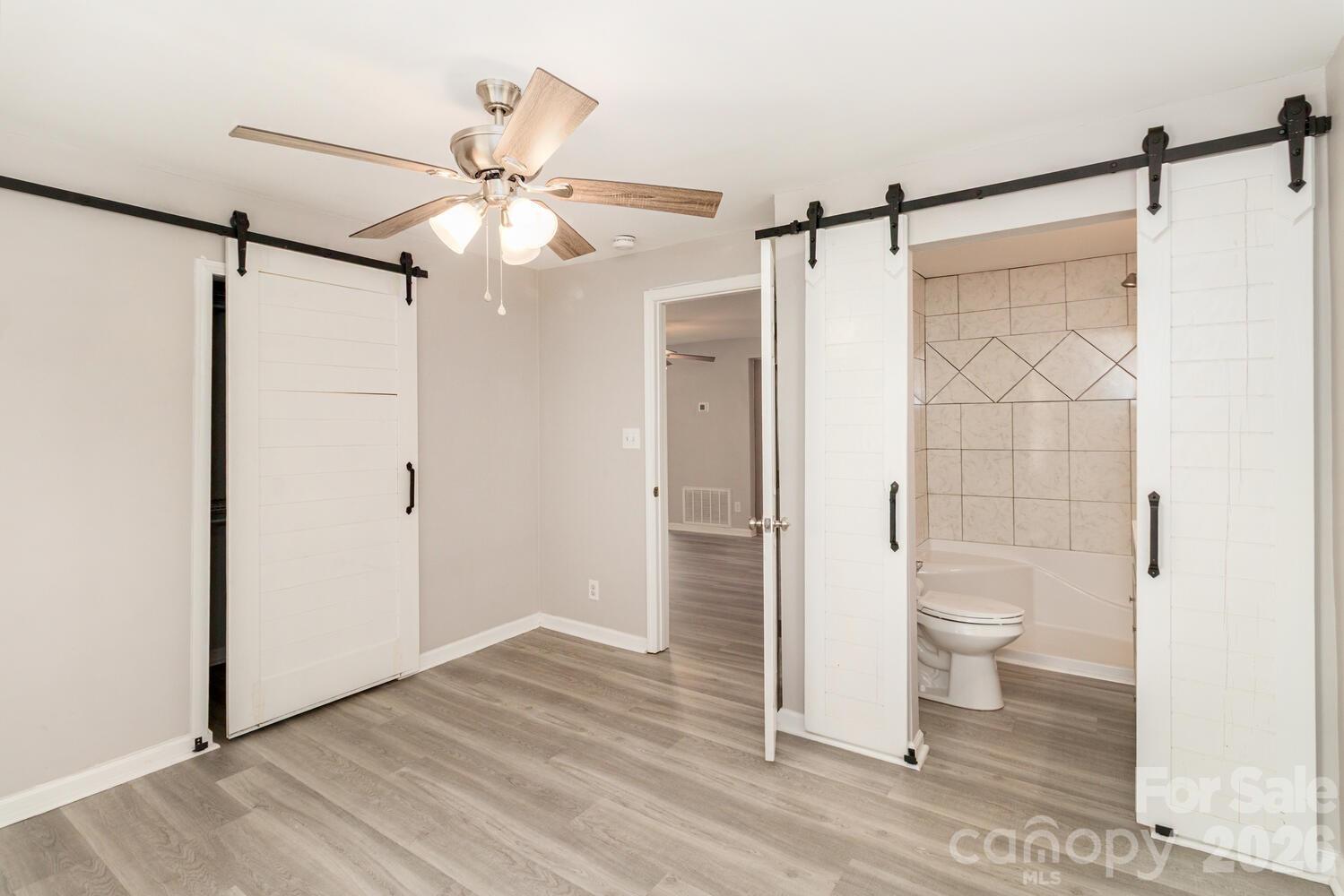 304 Bell Street Kannapolis, NC 28081 - Photo 16 of 27 a bathroom with a toilet and a shower