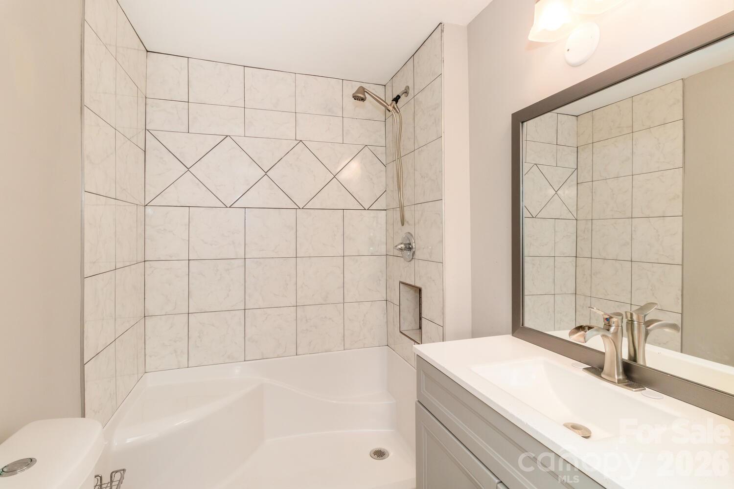 304 Bell Street Kannapolis, NC 28081 - Photo 18 of 27 a bathroom with a sink and a bathtub