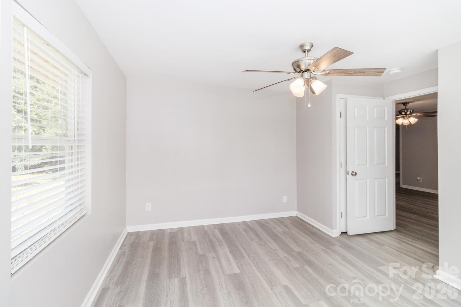 304 Bell Street Kannapolis, NC 28081 - Photo 22 of 27 wooden floor in an empty room with a window