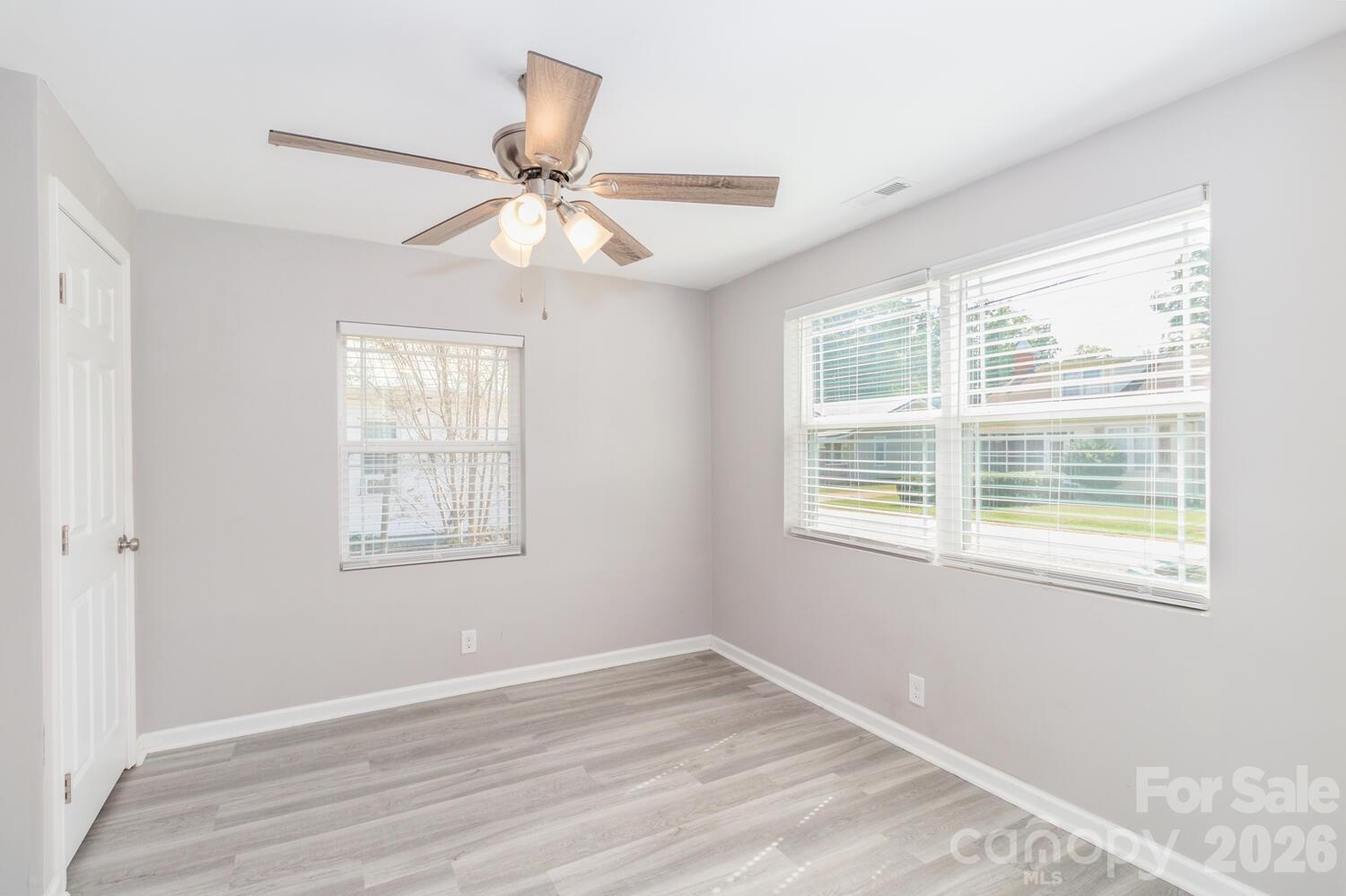 304 Bell Street Kannapolis, NC 28081 - Photo 23 of 27 a view of an empty room with wooden floor and a window