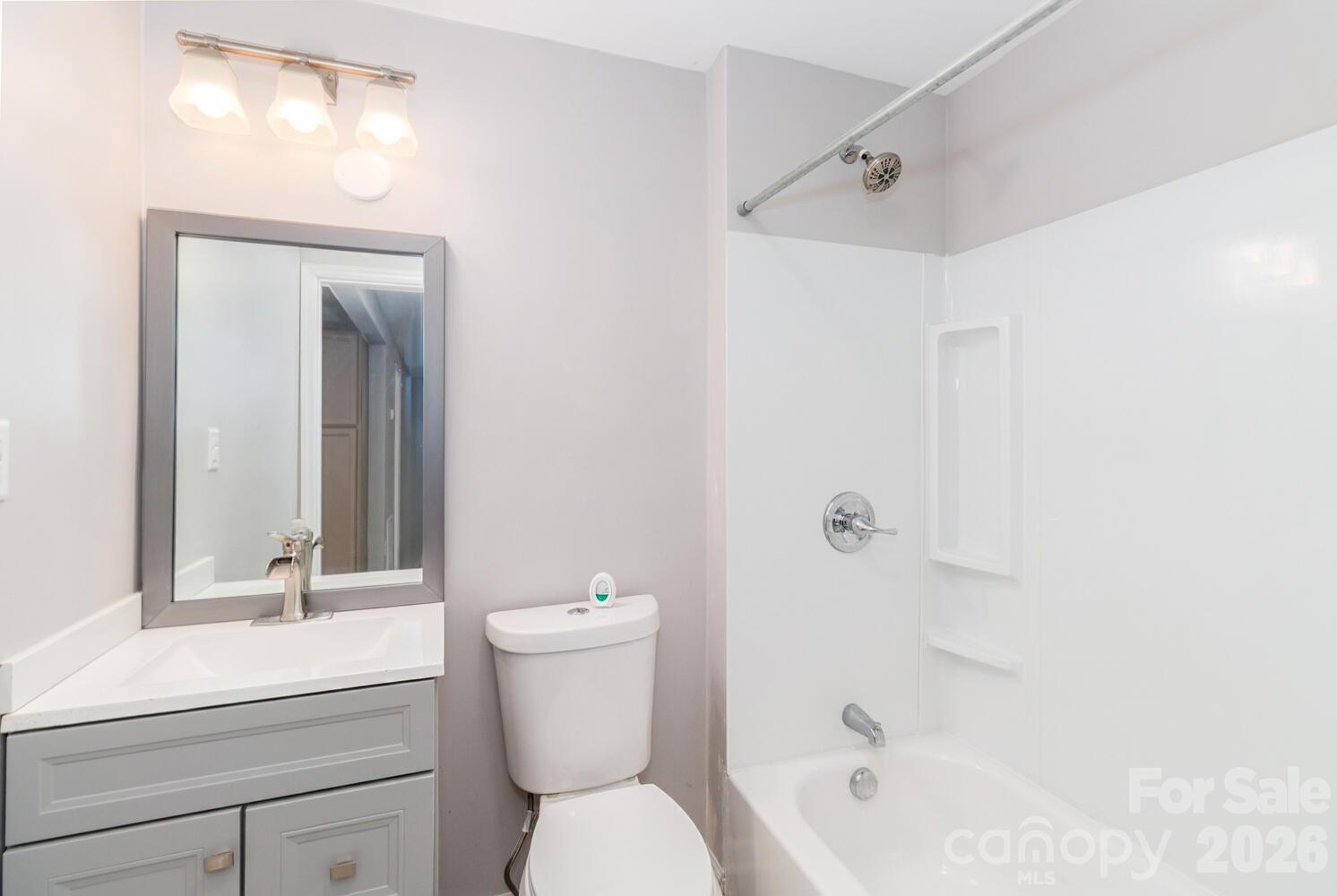 304 Bell Street Kannapolis, NC 28081 - Photo 25 of 27 a bathroom with a sink a toilet and shower