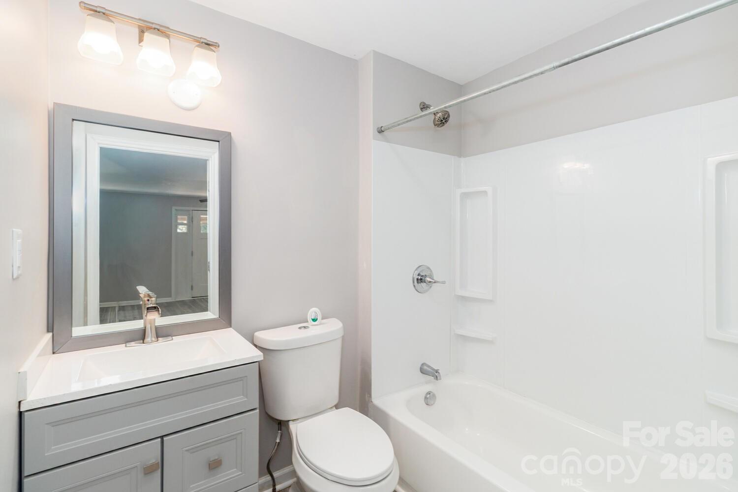 304 Bell Street Kannapolis, NC 28081 - Photo 26 of 27 a bathroom with a sink a toilet and shower