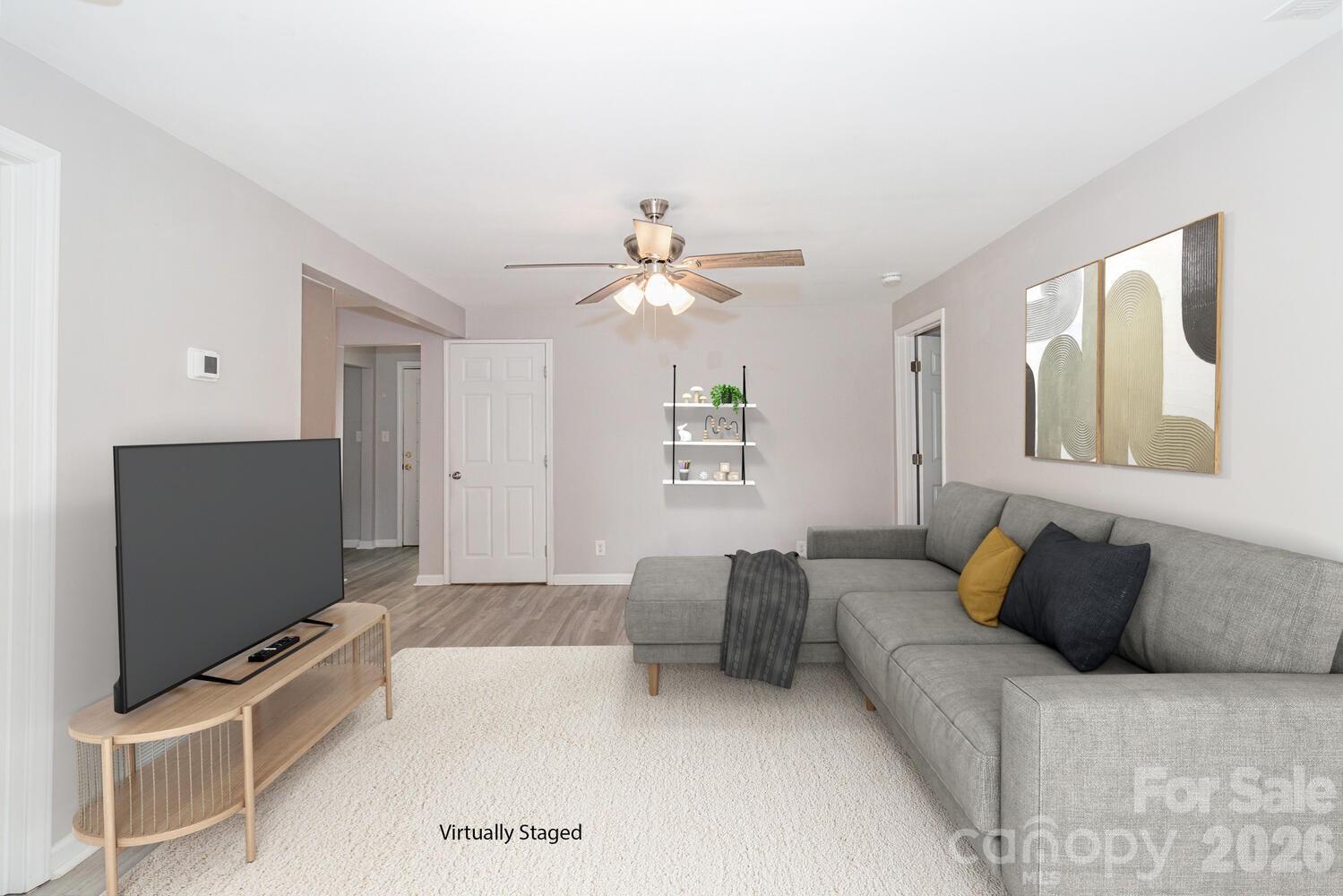 304 Bell Street Kannapolis, NC 28081 - Photo 3 of 27 a living room with furniture and a flat screen tv