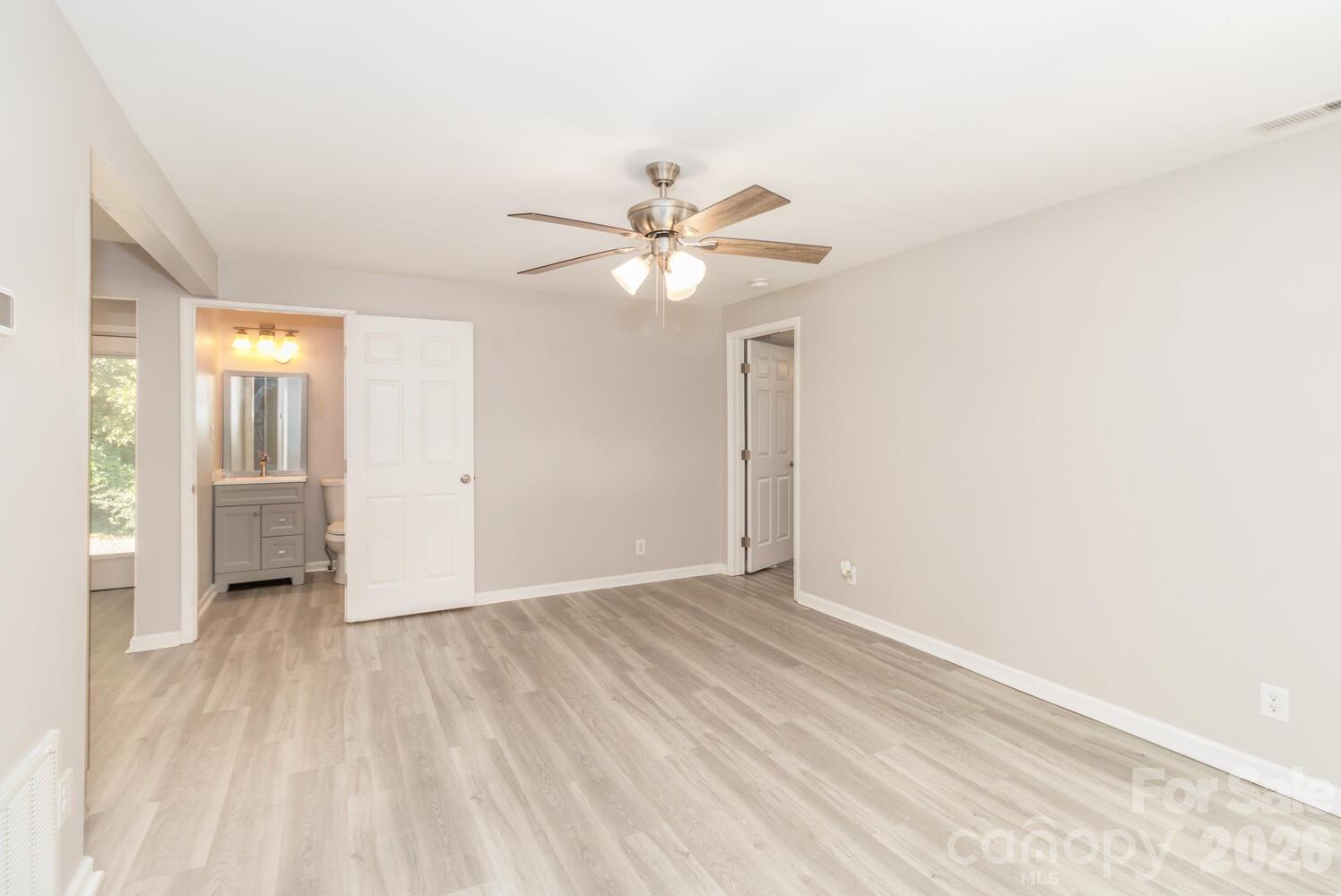 304 Bell Street Kannapolis, NC 28081 - Photo 5 of 27 wooden floor in an empty room with a window
