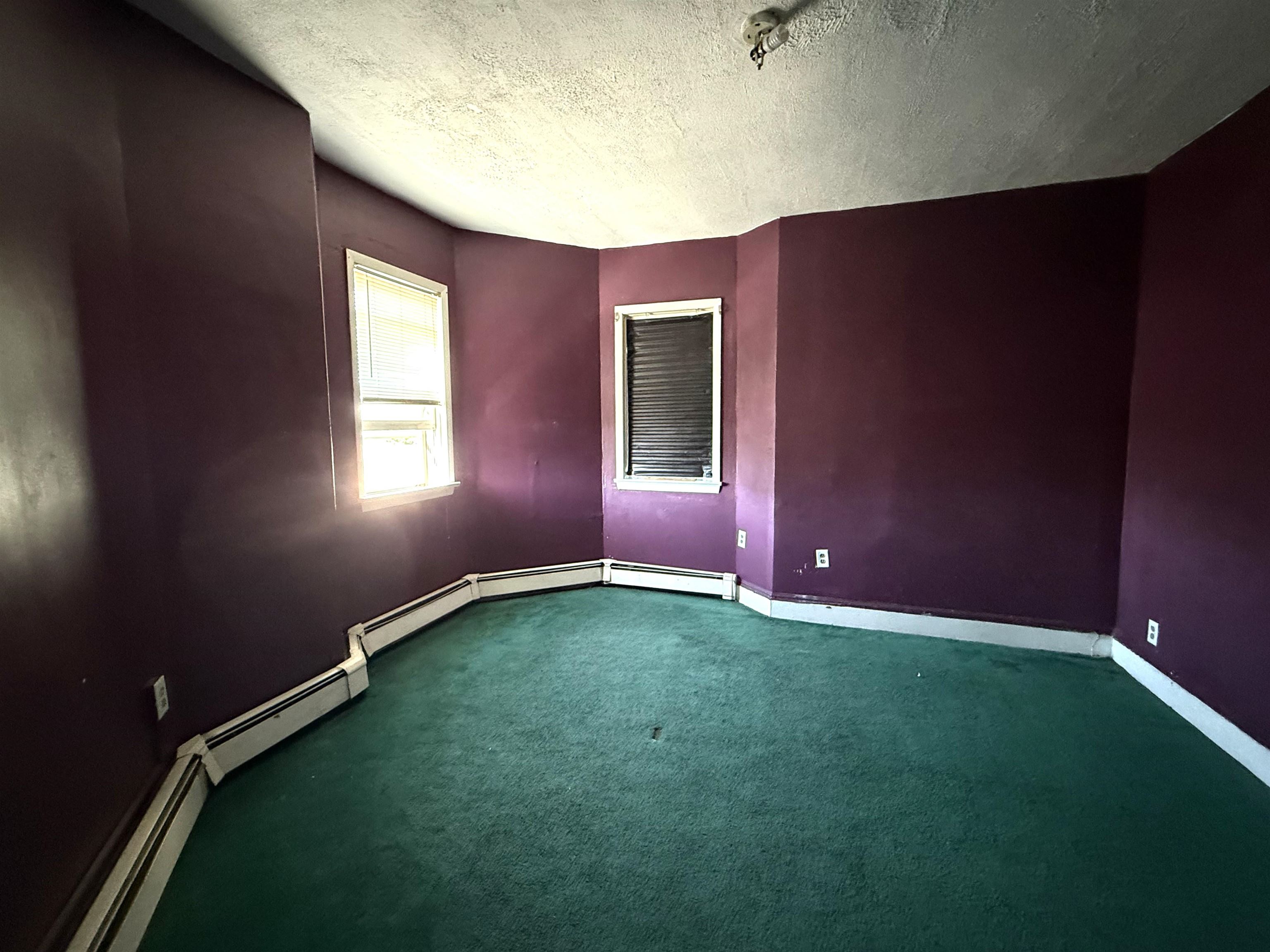 910-912 Broadway, Unit 3 Bayonne, NJ 07002 - Photo 2 of 10 a view of an empty room and window