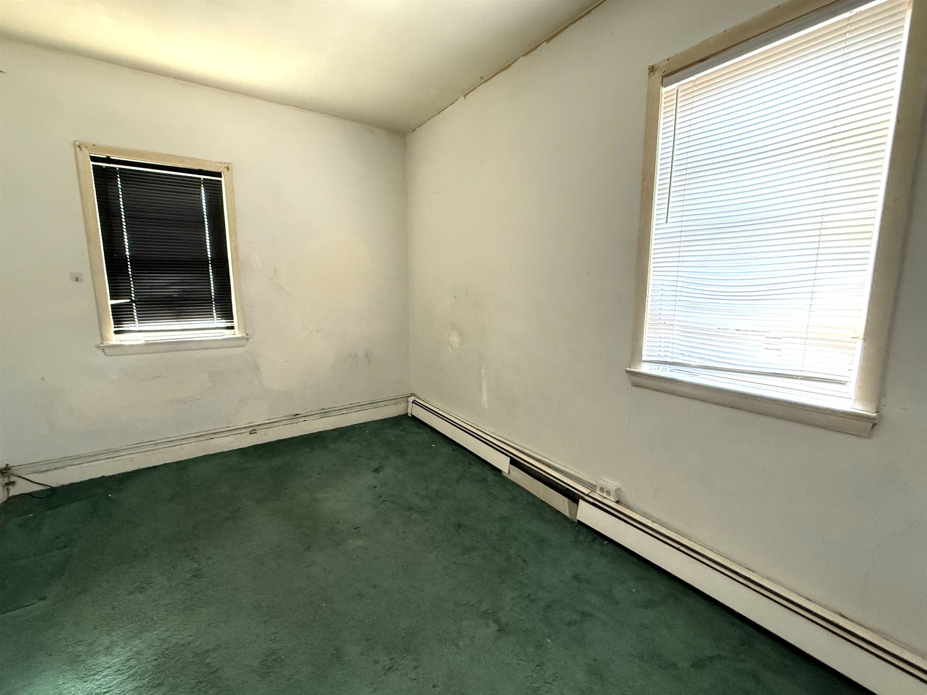 910-912 Broadway, Unit 3 Bayonne, NJ 07002 - Photo 6 of 10 an empty room with a window
