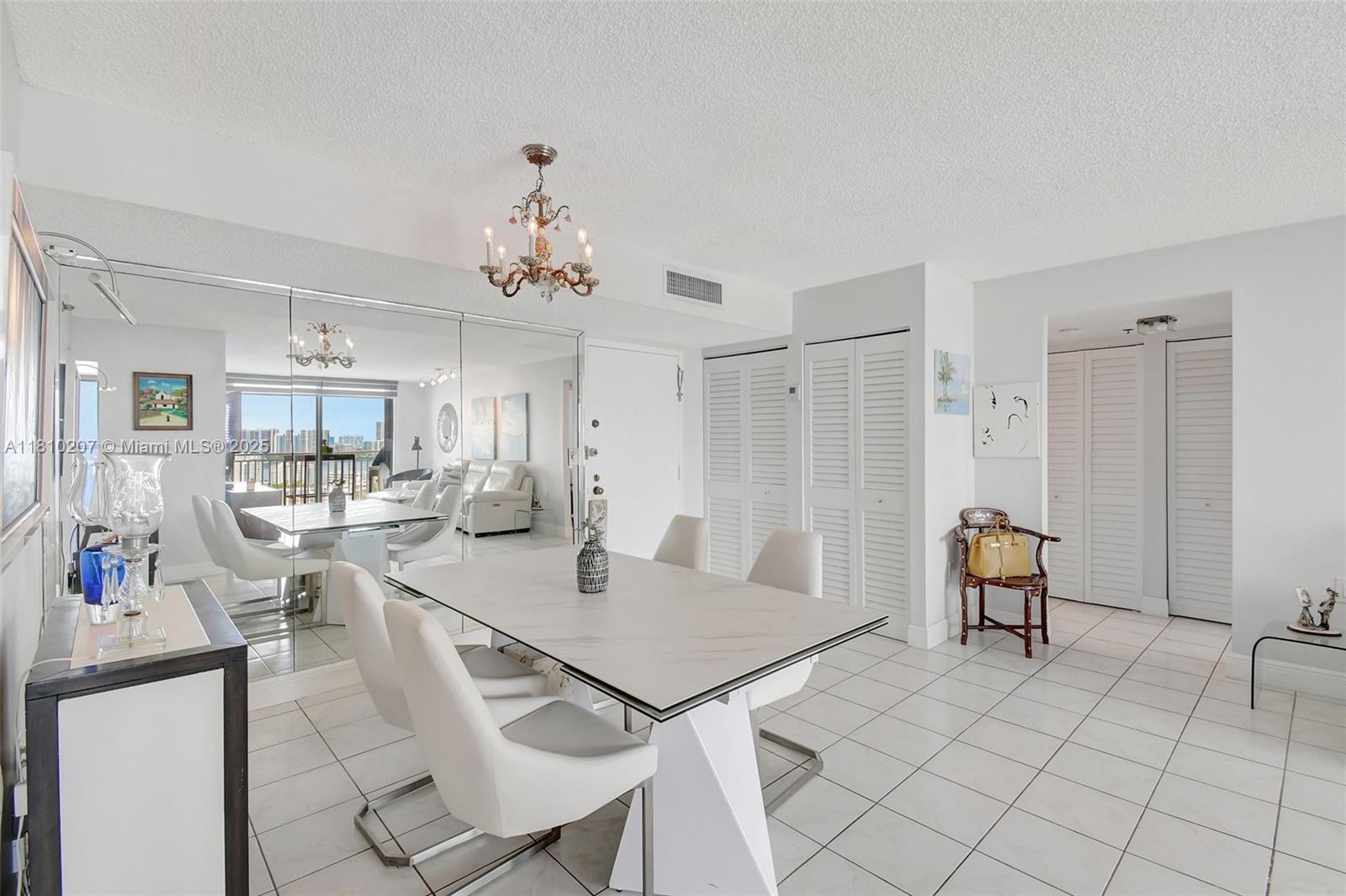 210 174th Street, Unit 2212 Sunny Isles Beach, FL 33160 - Photo 15 of 39 a view of a dining room with furniture
