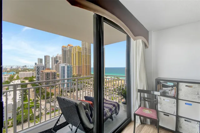 a view of a balcony with furniture