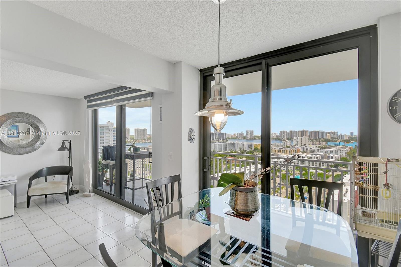210 174th Street, Unit 2212 Sunny Isles Beach, FL 33160 - Photo 20 of 39 a view of a chairs and table in a room