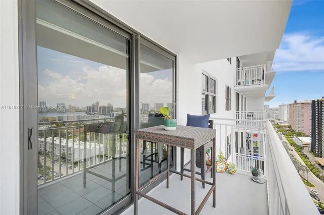 a view of a balcony with chairs