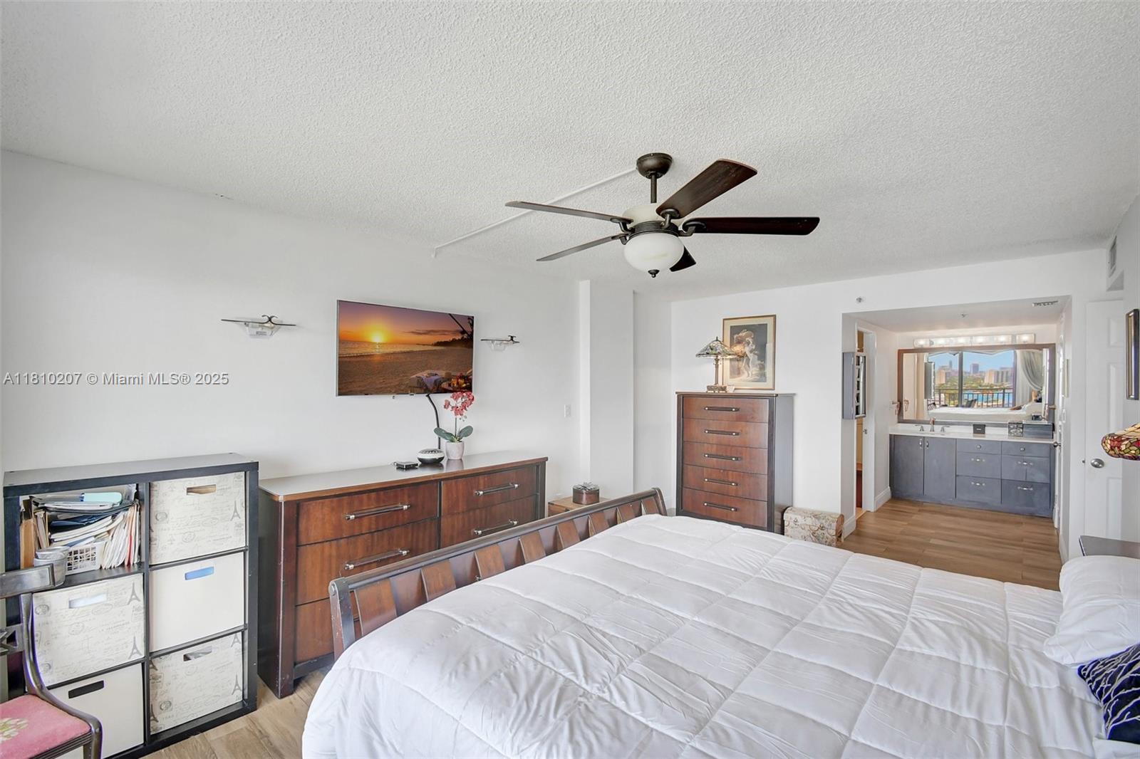 210 174th Street, Unit 2212 Sunny Isles Beach, FL 33160 - Photo 28 of 39 a bedroom with a bed and a flat screen tv