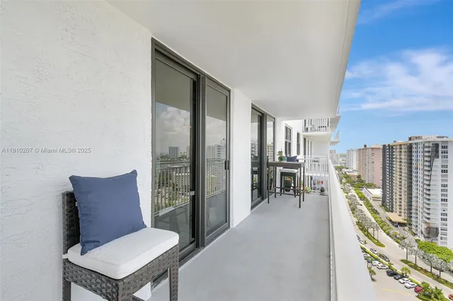 a balcony with furniture and city view