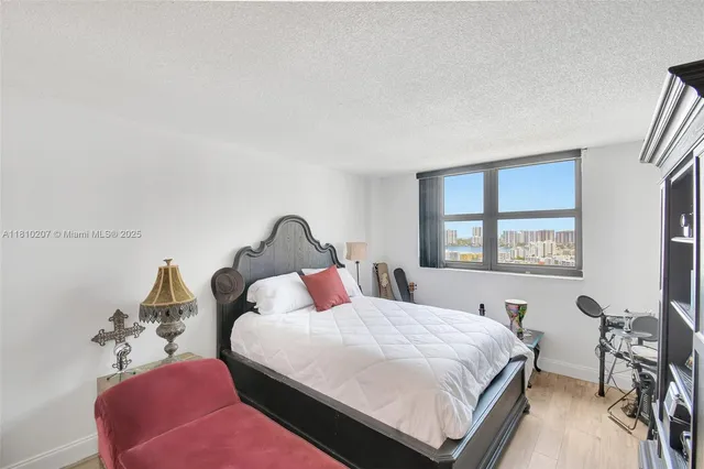 a bedroom with bed and a window