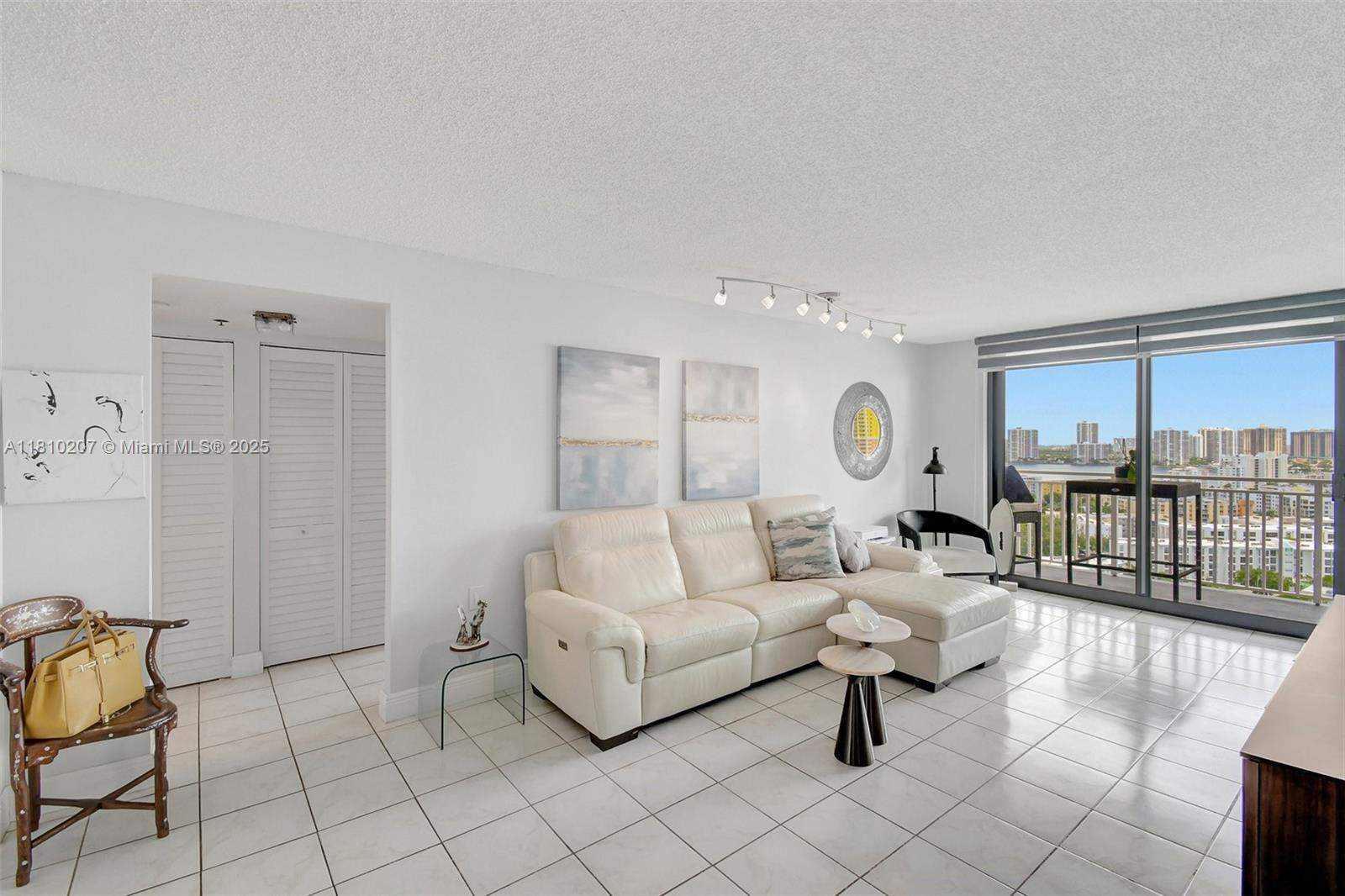 210 174th Street, Unit 2212 Sunny Isles Beach, FL 33160 - Photo 9 of 39 a living room with furniture