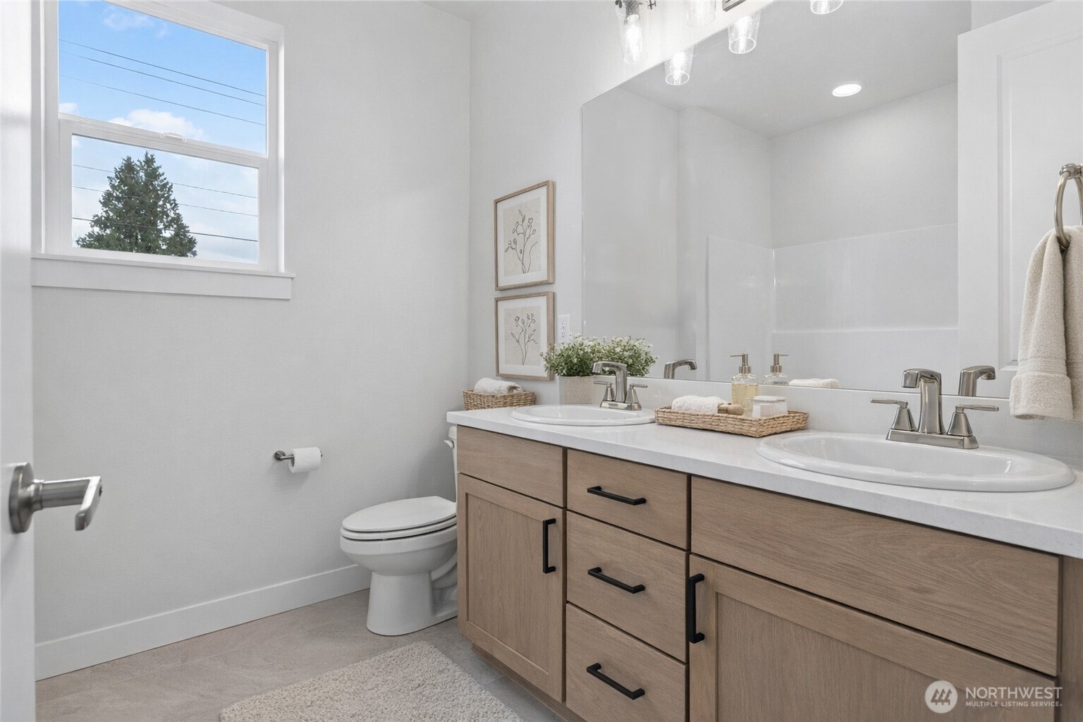 636 Prominence Street Winlock, WA 98596 - Photo 12 of 18 a bathroom with a granite countertop sink a toilet and a mirror