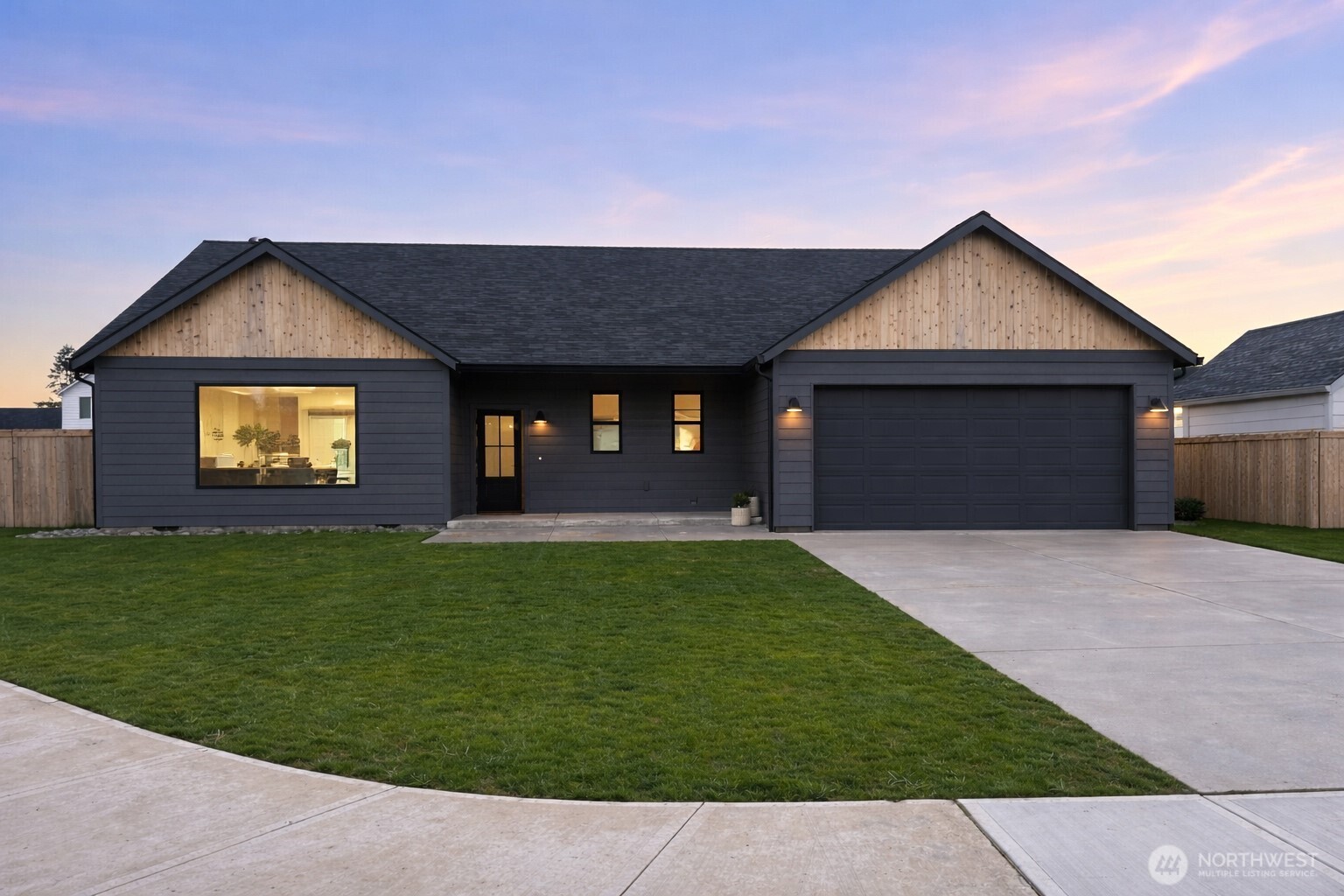 636 Prominence Street Winlock, WA 98596 - Photo 18 of 18 a front view of a house with a yard and garage
