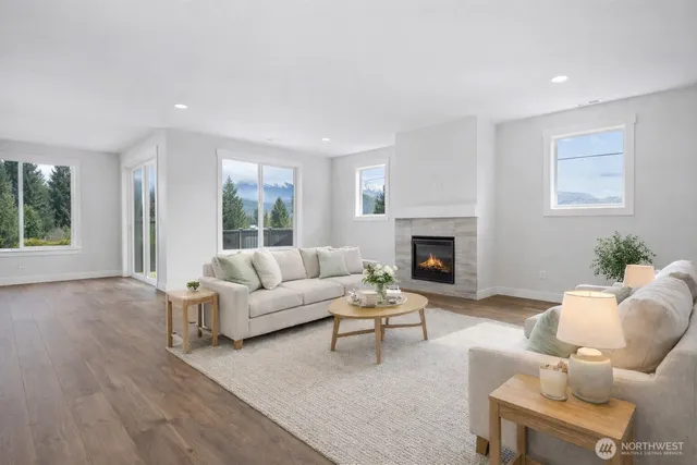 a living room with furniture a window and a fireplace