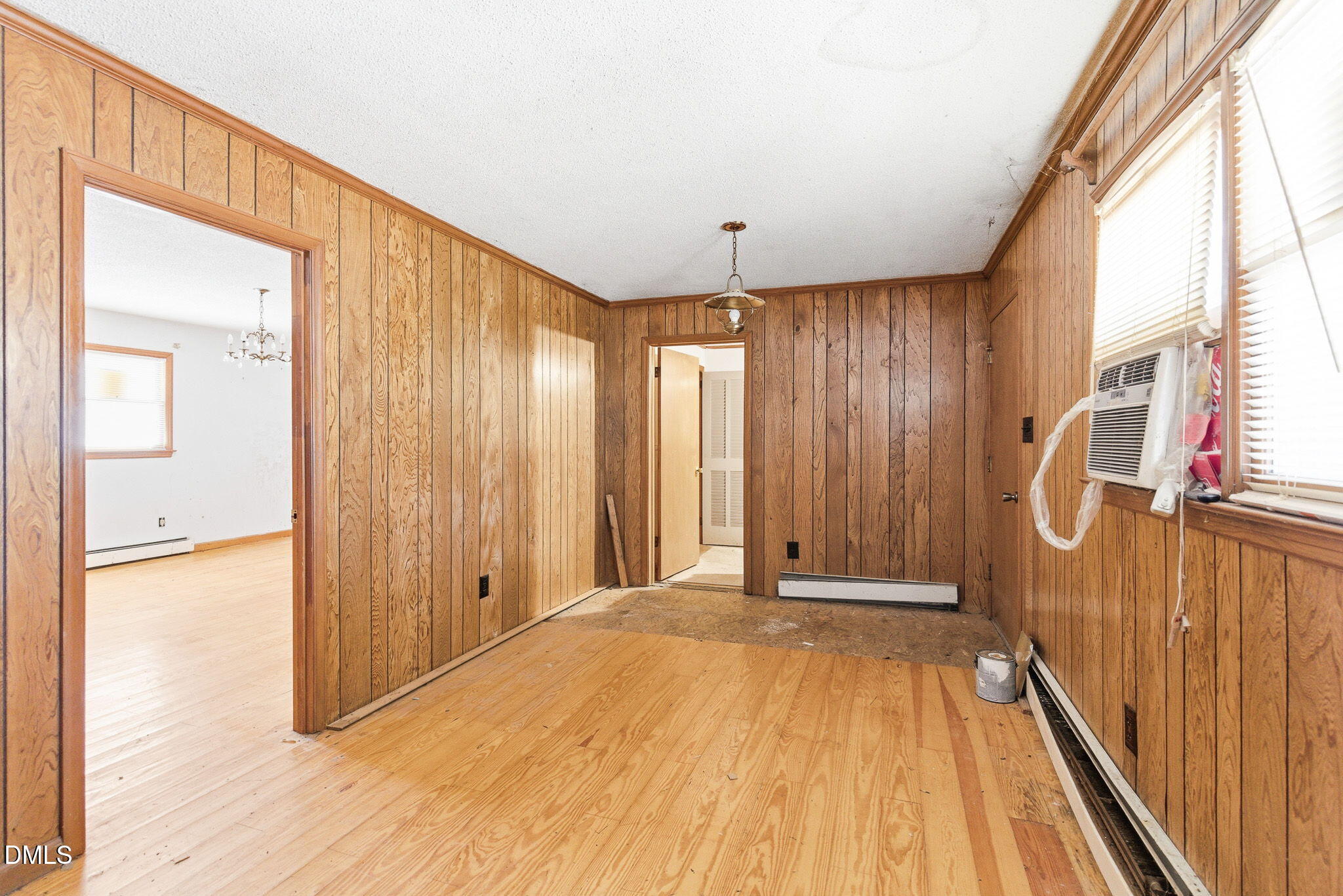 1603 Sykes Road Mebane, NC 27302 - Photo 21 of 45 a view of a hallway with wooden floor and staircase