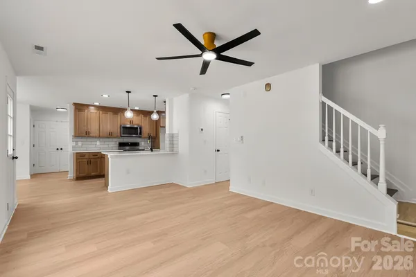 a view of a kitchen with a sink and a stove top oven