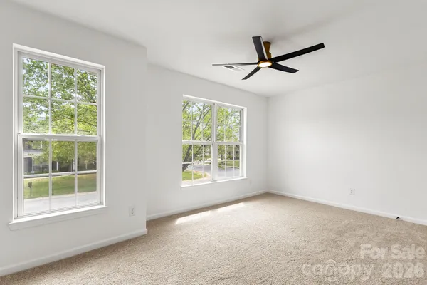 a view of empty room with windows