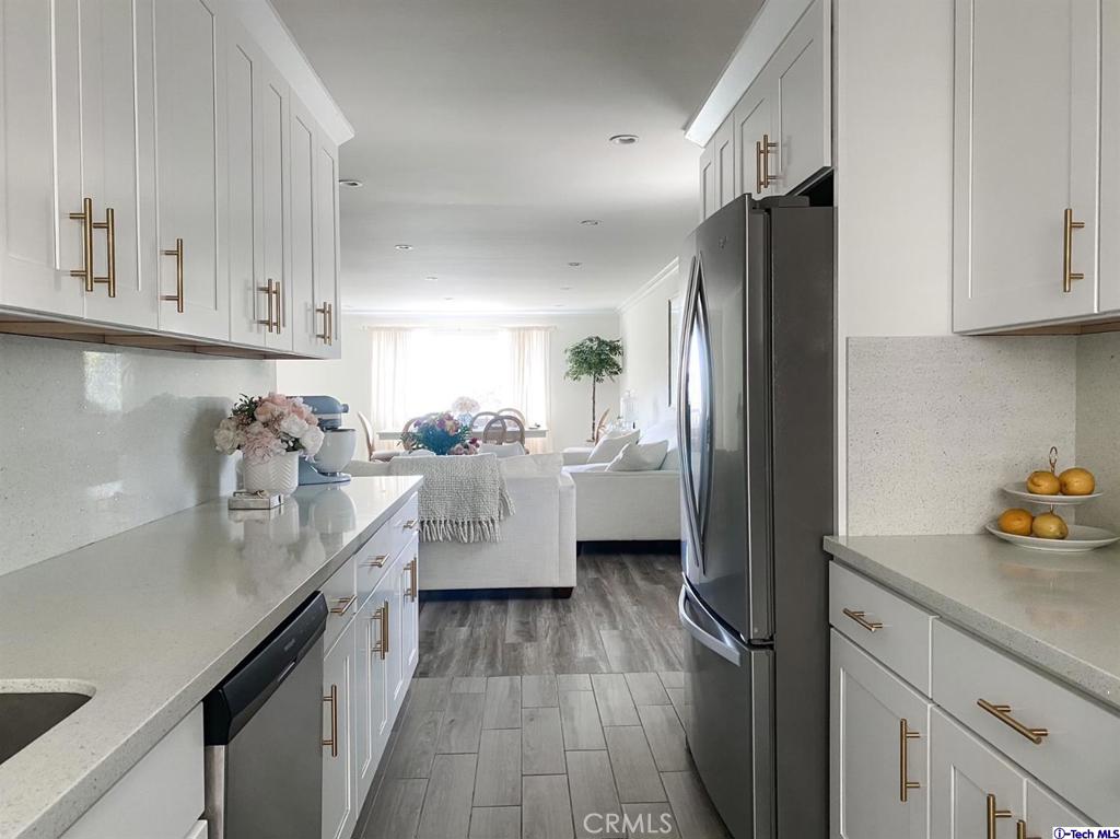 a kitchen with counter top space and cabinets