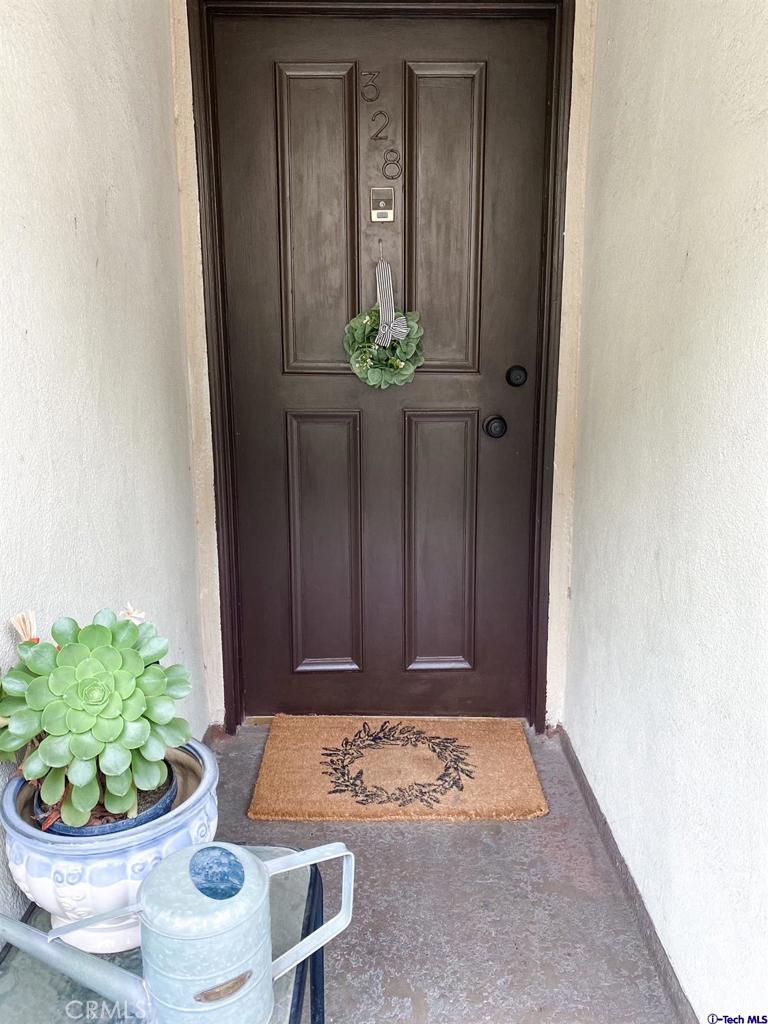 1935 Alpha Road, Unit 328 Glendale, CA 91208 - Photo 11 of 16 a room with a table and a potted plant
