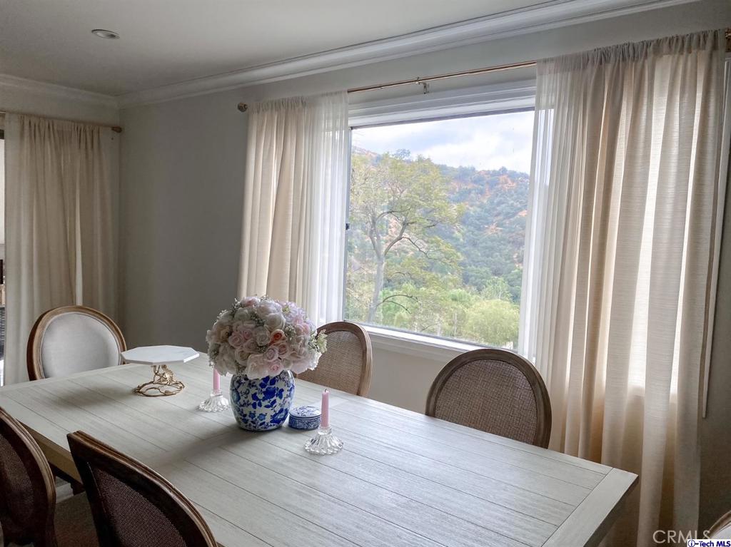 1935 Alpha Road, Unit 328 Glendale, CA 91208 - Photo 2 of 16 a dining room with furniture and wooden floor