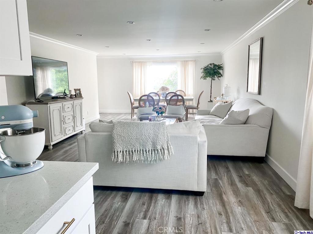 1935 Alpha Road, Unit 328 Glendale, CA 91208 - Photo 4 of 16 a living room with furniture and a wooden floor