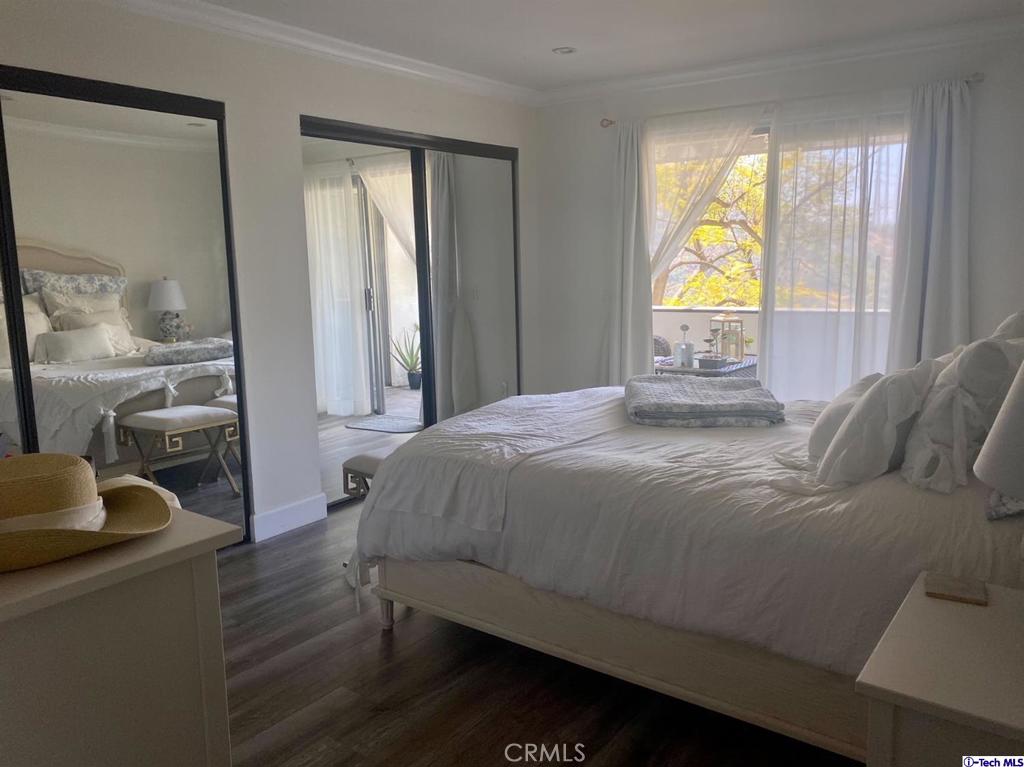 1935 Alpha Road, Unit 328 Glendale, CA 91208 - Photo 5 of 16 a bedroom with a bed and a window