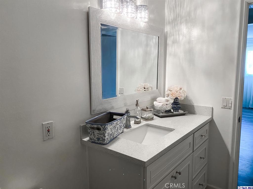 1935 Alpha Road, Unit 328 Glendale, CA 91208 - Photo 8 of 16 a bathroom with a sink and a mirror