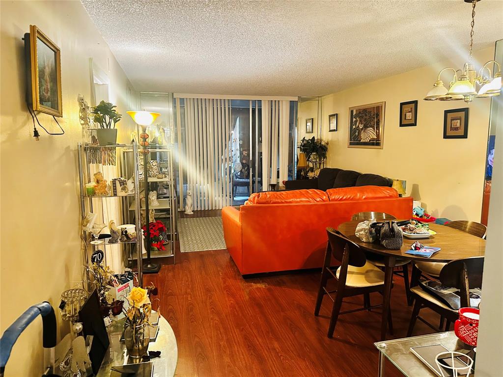 3070 Northwest 48th Terrace, Unit 307 Lauderdale Lakes, FL 33313 - Photo 2 of 13 a room with table and chairs