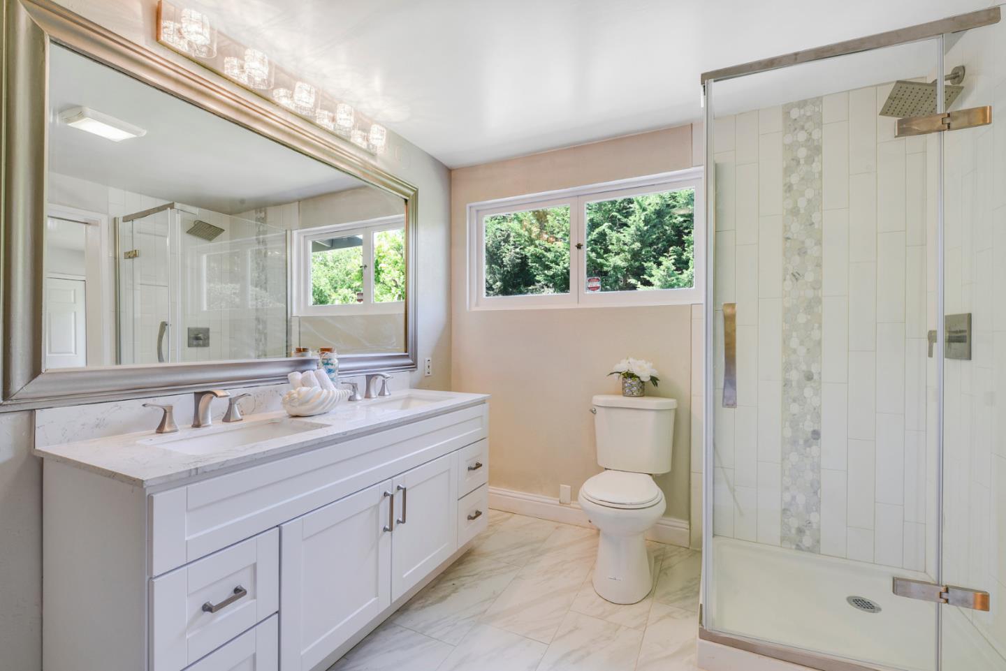 254 Reed Boulevard Mill Valley, CA 94941 - Photo 13 of 21 a spacious bathroom with a double vanity sink toilet mirror and shower