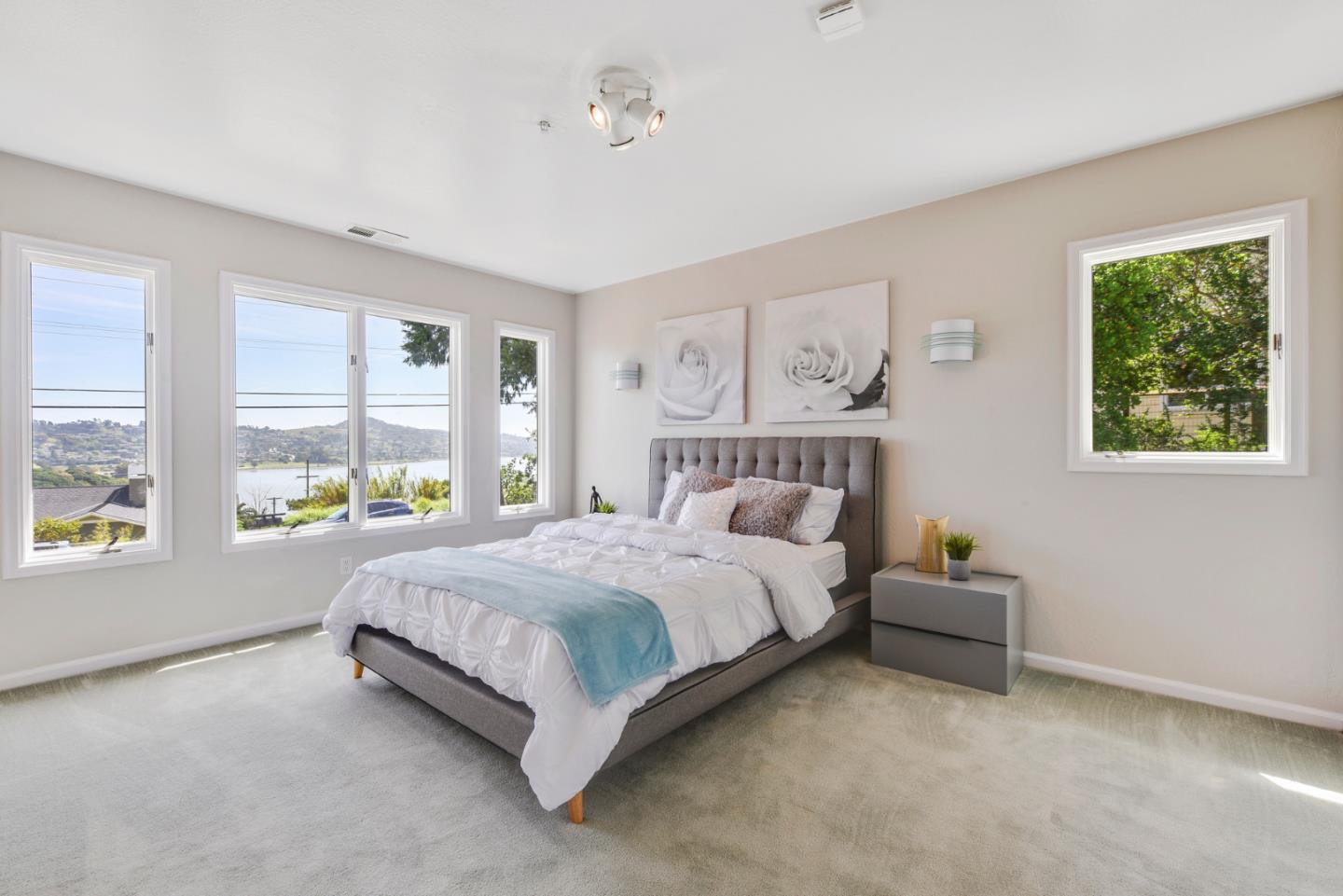 254 Reed Boulevard Mill Valley, CA 94941 - Photo 15 of 21 a bedroom with a bed lamp and window