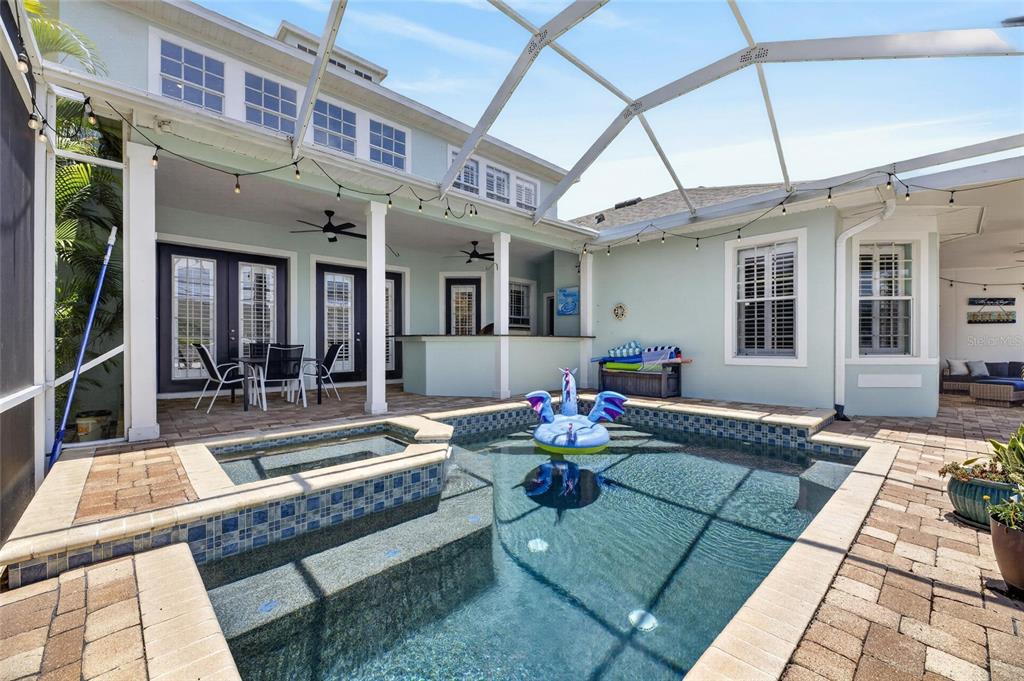 508 Islebay Drive Apollo Beach, FL 33572 - Photo 4 of 98 a view of a patio with chairs and tables