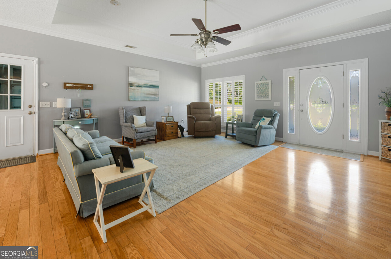 646 Corey Street Baxley, GA 31513 - Photo 11 of 21 a living room with furniture and a wooden floor