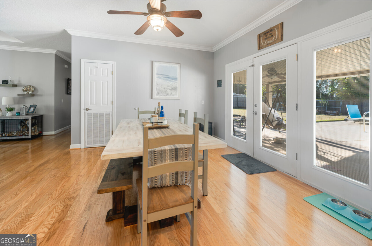 646 Corey Street Baxley, GA 31513 - Photo 13 of 21 a view of a dining room with furniture window and wooden floor