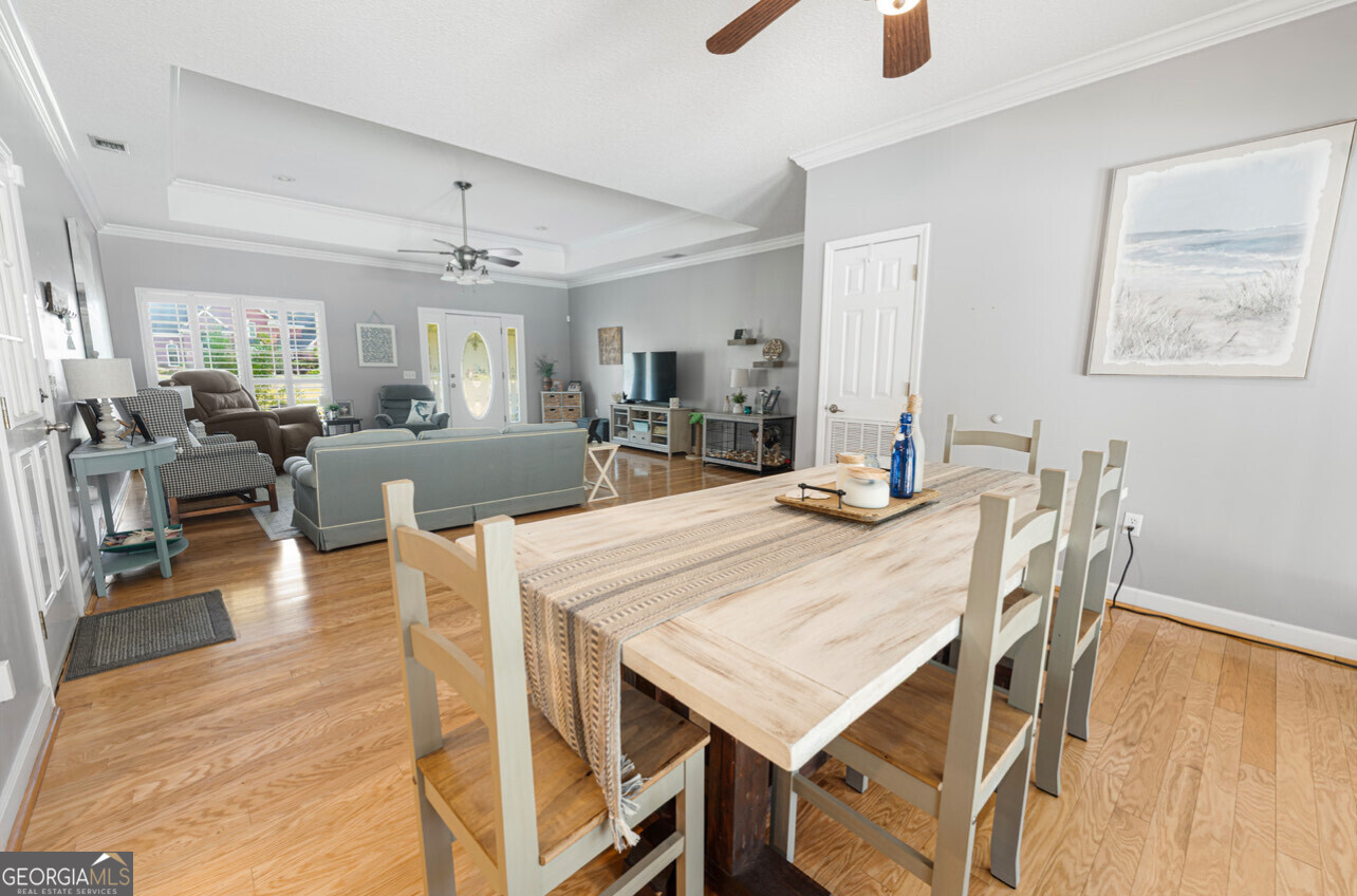 646 Corey Street Baxley, GA 31513 - Photo 14 of 21 a view of a dining room with furniture and wooden floor