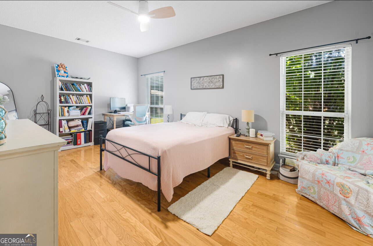 646 Corey Street Baxley, GA 31513 - Photo 18 of 21 a bedroom with a bed and a large window