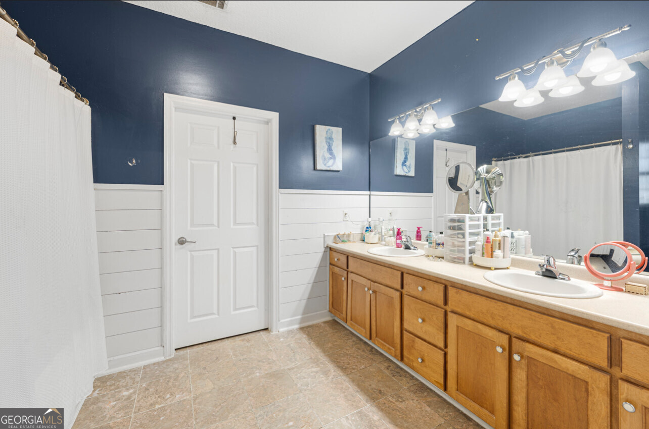 646 Corey Street Baxley, GA 31513 - Photo 20 of 21 a bathroom with a sink and a mirror