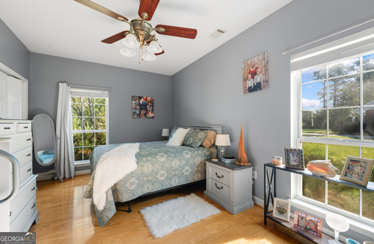 646 Corey Street Baxley, GA 31513 - Photo 21 of 21 a bedroom with a bed and a window