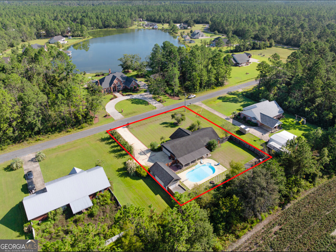 646 Corey Street Baxley, GA 31513 - Photo 4 of 21 an aerial view of a house with a lake view