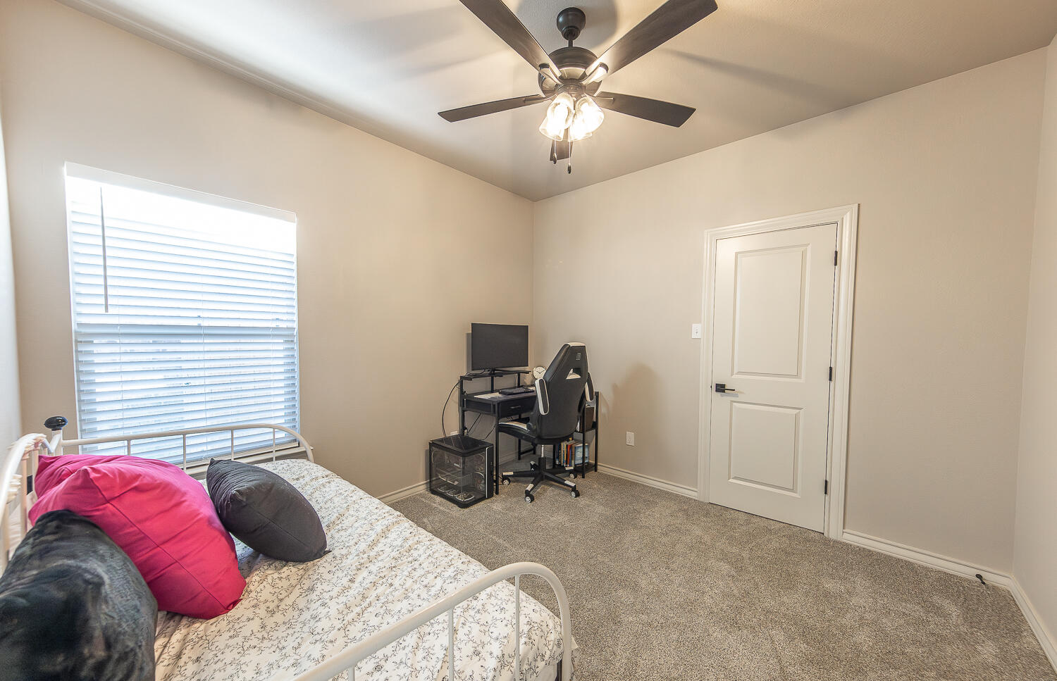6913 15th Street Lubbock, TX 79416 - Photo 20 of 27 a bedroom with a bed and a chair