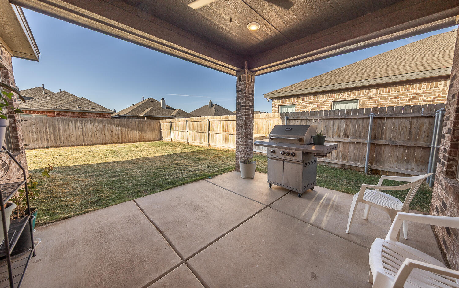 6913 15th Street Lubbock, TX 79416 - Photo 22 of 27 a view of a backyard with seating area