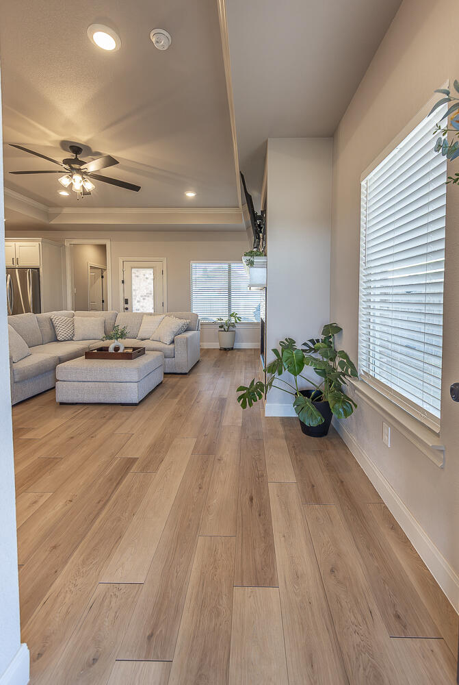 6913 15th Street Lubbock, TX 79416 - Photo 4 of 27 a very nice looking room with a large window