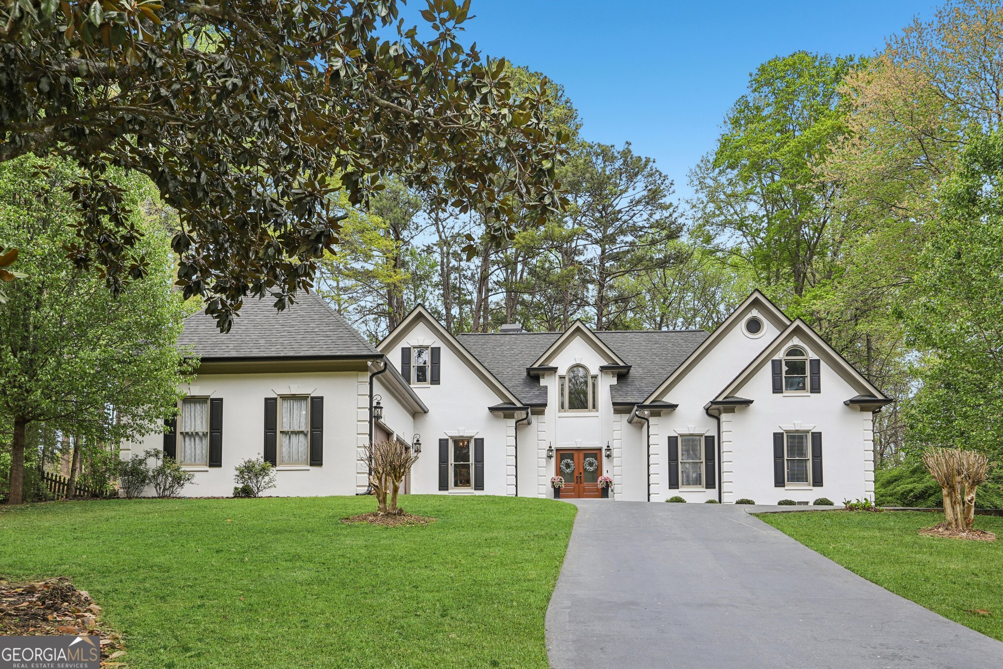 100 Kylemore Pass Tyrone, GA 30290 - Photo 1 of 1 a front view of a house with a yard