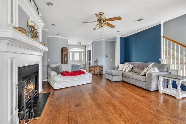 a living room with furniture and a fireplace
