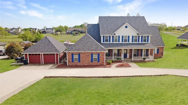 front view of a house with a yard